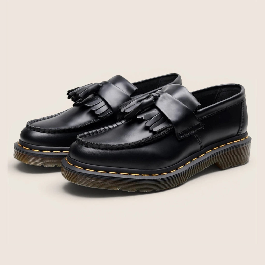 Norielle black leather tassel loafers with a classic slip-on design and Goodyear welt construction.
