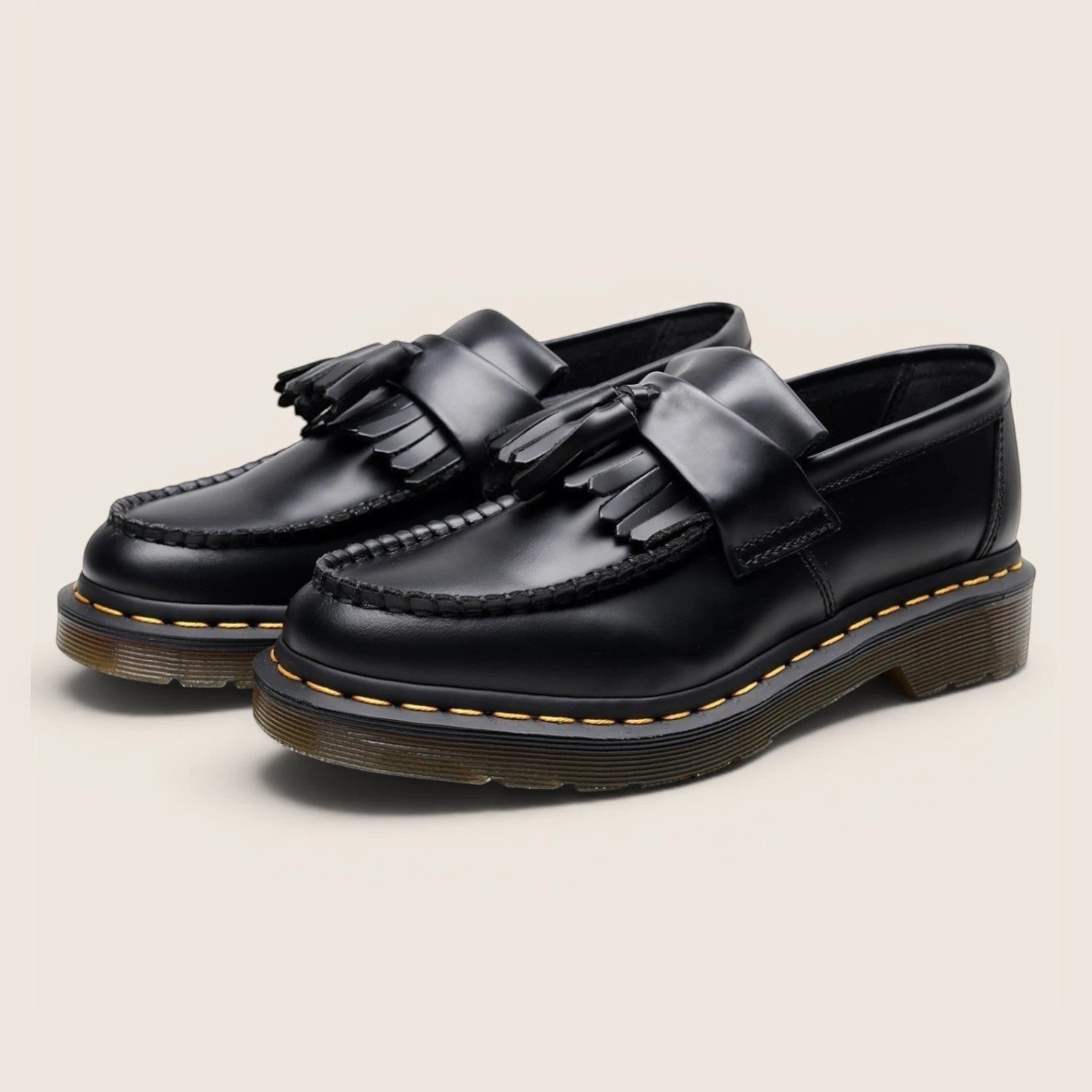 Norielle black leather tassel loafers with a classic slip-on design and Goodyear welt construction.