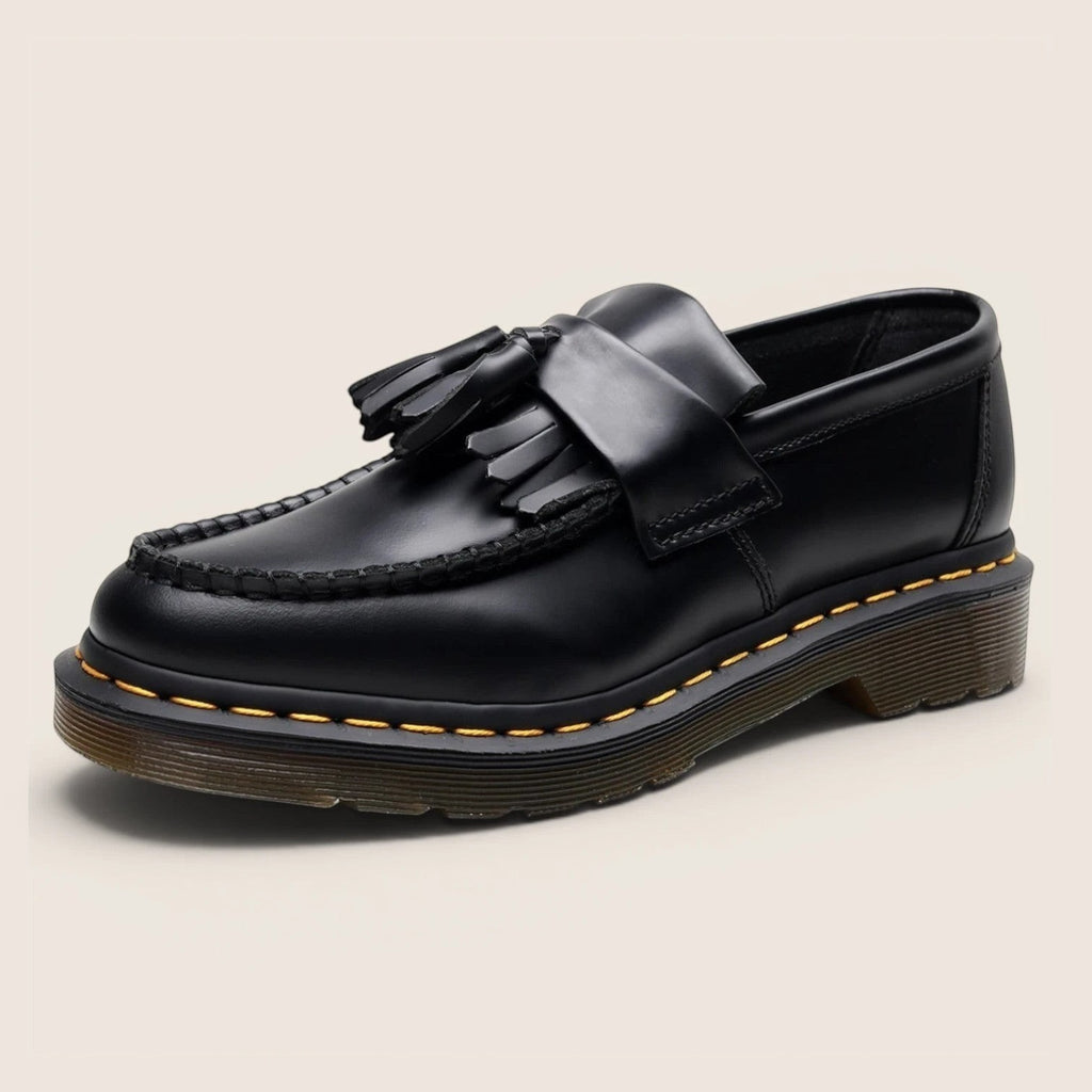 Norielle black leather tassel loafers with a classic slip-on design and Goodyear welt stitching.