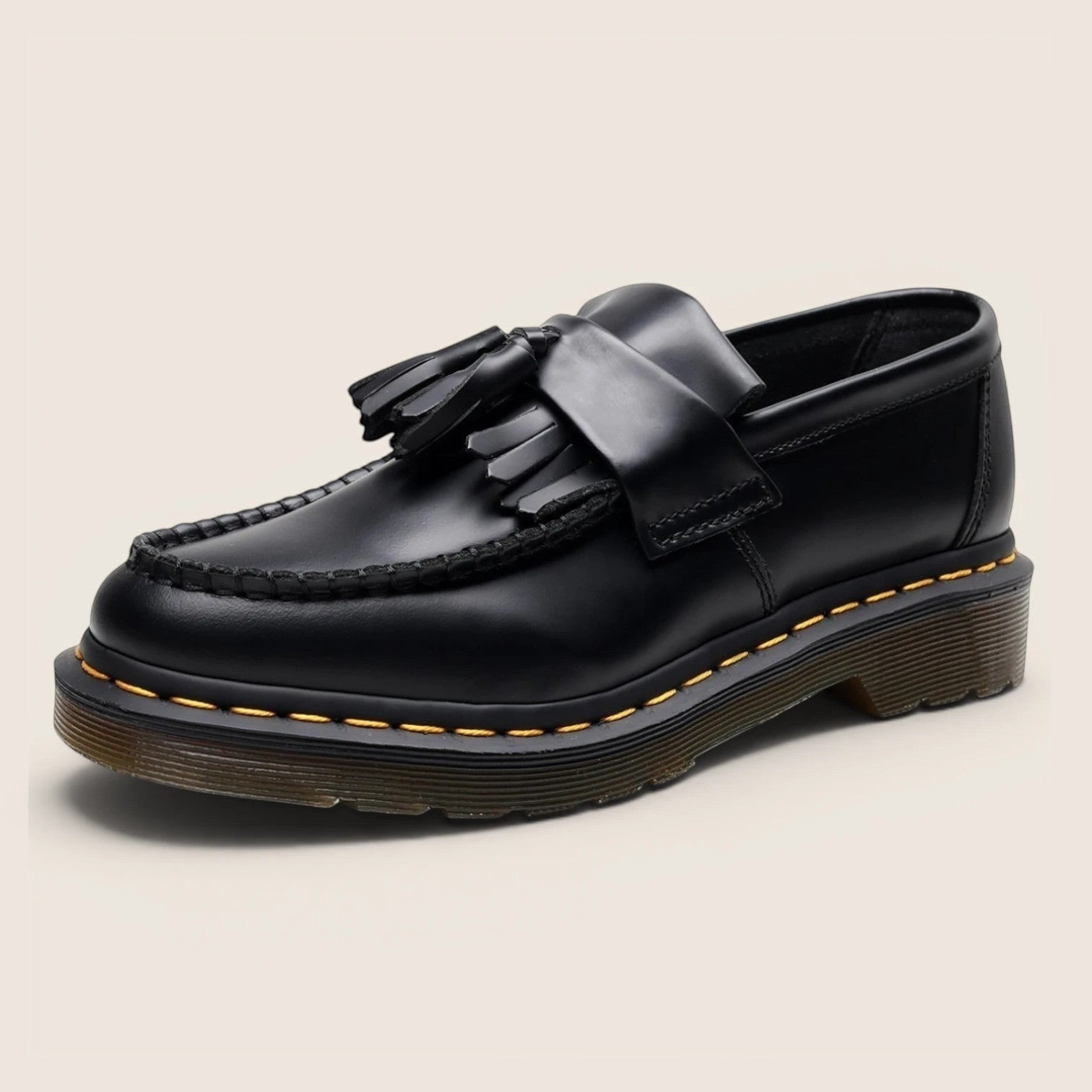 Norielle black leather tassel loafers with a classic slip-on design and Goodyear welt stitching.