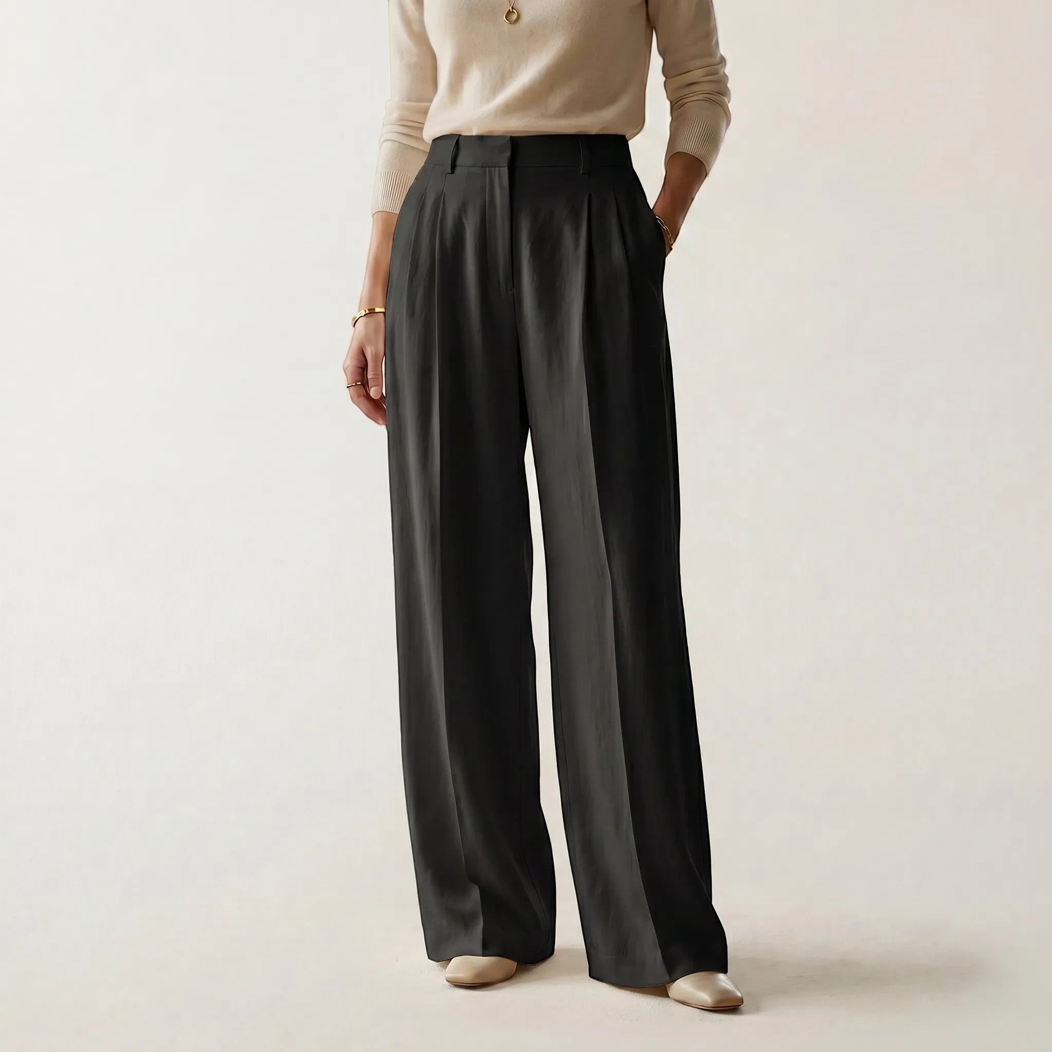 Norielle women's black high-waisted straight leg pants with a relaxed fit and pleats.