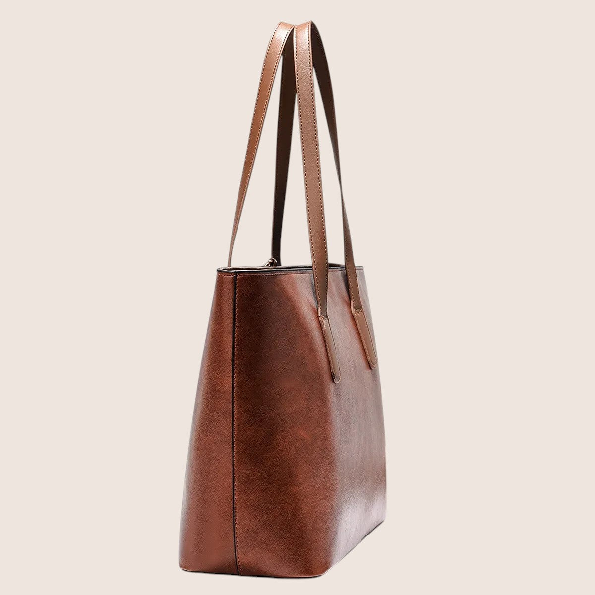 Norielle brown PU leather bucket shoulder bag with dual straps and interior pockets. Versatile for daily use.
