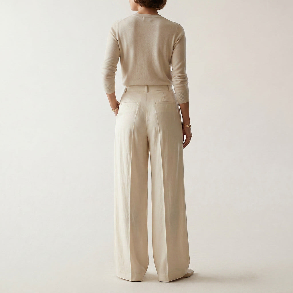 Norielle women's high-waisted cream straight leg pants with a relaxed fit, detailed with pockets.