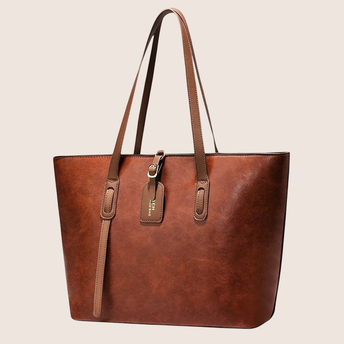 Norielle dark brown PU leather tote shoulder bag with buckle detail and hanging tag, versatile for daily use.