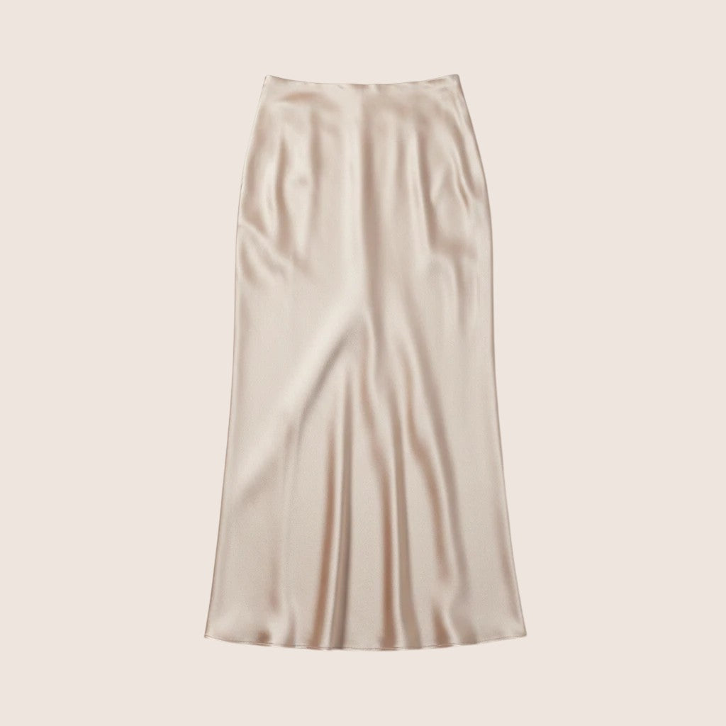 Norielle champagne silk A-line midi skirt with high waist and elegant drape.