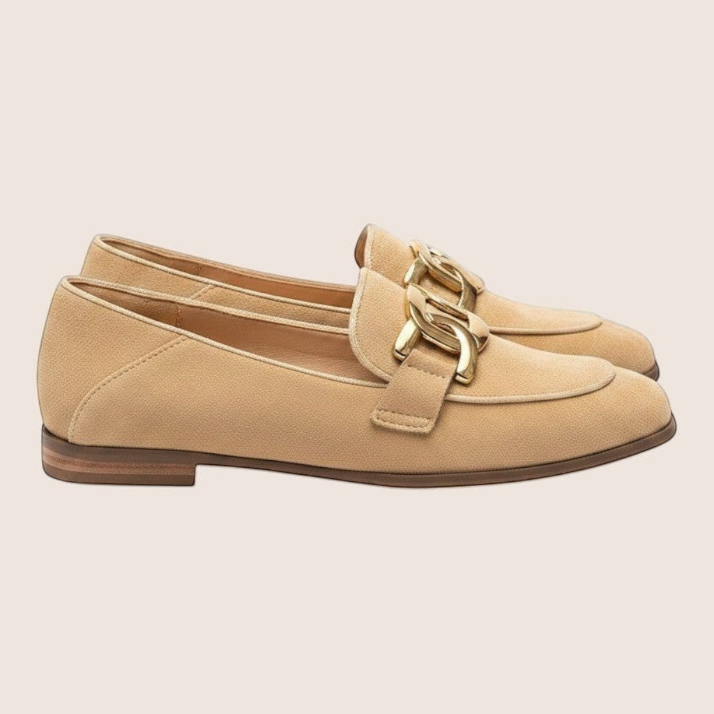 Norielle women's beige microfiber loafers with gold chain detail and a thick heel.